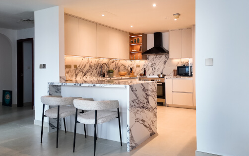 Open-Concept Marble Waterfall Kitchen